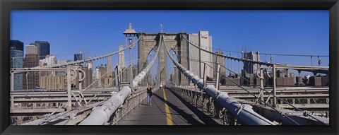 Framed Rear view of a woman walking on a bridge, Brooklyn Bridge, Manhattan, New York City, New York State, USA Print