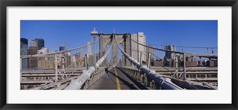 Framed Rear view of a woman walking on a bridge, Brooklyn Bridge, Manhattan, New York City, New York State, USA Print