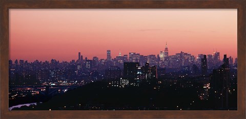 Framed High angle view of buildings lit up at dusk, Manhattan, New York City, New York State, USA Print