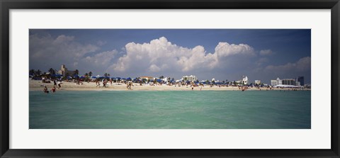 Framed Tourists on the beach, Miami, Florida, USA Print