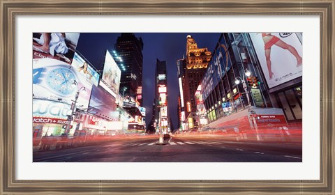 Framed Low angle view of sign boards lit up at night, Times Square, New York City, New York, USA Print