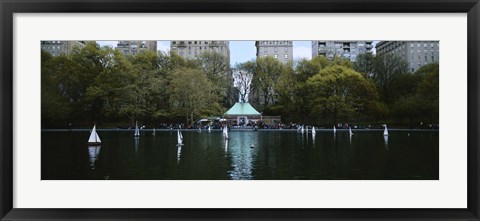 Framed Toy boats floating on water, Central Park, Manhattan Print