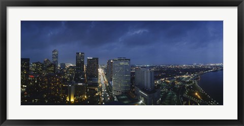 Framed High angle view of buildings in a city lit up at night, New Orleans, Louisiana, USA Print