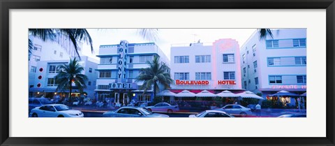 Framed Traffic on road in front of hotels, Ocean Drive, Miami, Florida, USA Print