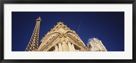 Framed Low angle view of a building in front of a replica of the Eiffel Tower, Paris Hotel, Las Vegas, Nevada, USA Print