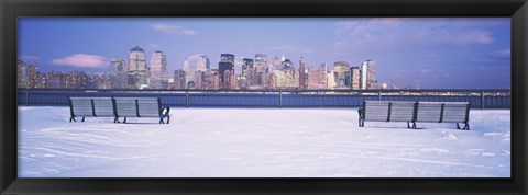 Framed Park benches in snow with a city in the background, Lower Manhattan, Manhattan, New York City, New York State, USA Print