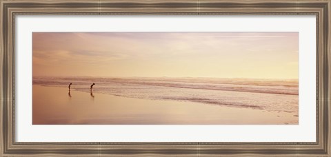 Framed Two children playing on the beach, San Francisco, California, USA Print