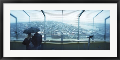 Framed Couple viewing a city from the Space Needle, Queen Anne Hill, Seattle, Washington State, USA Print