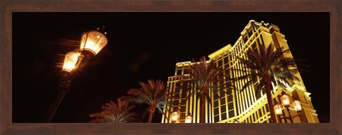 Framed Low angle view of a hotel lit up at night, The Strip, Las Vegas, Nevada, USA Print