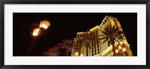 Framed Low angle view of a hotel lit up at night, The Strip, Las Vegas, Nevada, USA Print