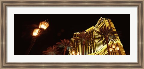 Framed Low angle view of a hotel lit up at night, The Strip, Las Vegas, Nevada, USA Print