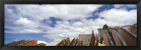 Framed Low angle view of skyscrapers and surfboards, Honolulu, Oahu, Hawaii, USA Print