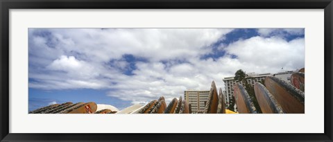 Framed Low angle view of skyscrapers and surfboards, Honolulu, Oahu, Hawaii, USA Print