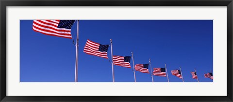 Framed Low angle view of American flags, Washington Monument, Washington DC, USA Print