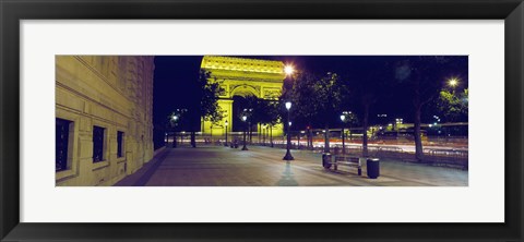 Framed France, Paris, Arc de Triomphe lit up at night Print