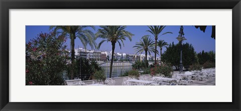 Framed Sidewalk cafe at the riverside, Guadalquivir River, Seville, Spain Print