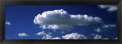 Framed Fluffy clouds in blue sky Print