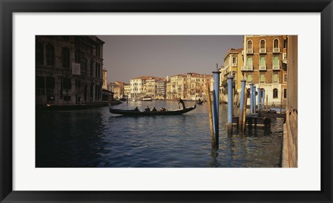 Framed Tourists sitting in a gondola, Grand Canal, Venice, Italy Print