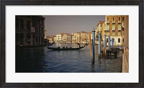 Framed Tourists sitting in a gondola, Grand Canal, Venice, Italy Print