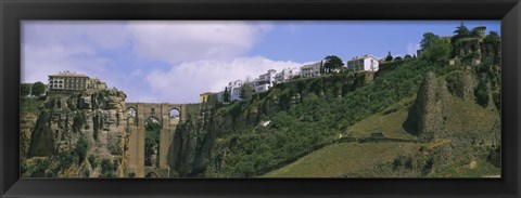 Framed Low angle view of a town, Tajo Bridge, Rio Guadalevin Gorge, Serrania De Ronda, Ronda, Andalusia, Spain Print