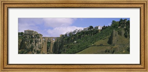 Framed Low angle view of a town, Tajo Bridge, Rio Guadalevin Gorge, Serrania De Ronda, Ronda, Andalusia, Spain Print
