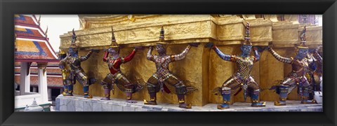 Framed Statues at base of golden chedi, The Grand Palace, Bangkok, Thailand Print