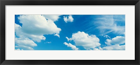 Framed Clouds against a pale blue sky Print