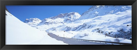 Framed Snow covered mountains on both sides of a road, St Moritz, Graubunden, Switzerland Print