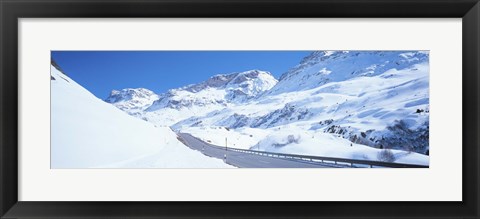 Framed Snow covered mountains on both sides of a road, St Moritz, Graubunden, Switzerland Print