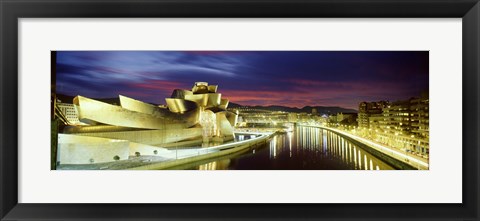 Framed Buildings lit up at dusk, Guggenheim Museum Bilbao, Bilbao, Vizcaya, Spain Print