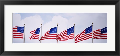 Framed Low angle view of American flags fluttering in wind Print