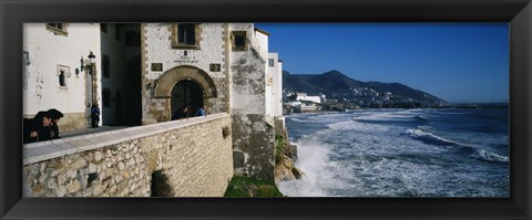 Framed Tourists in a church beside the sea, Sitges, Spain Print