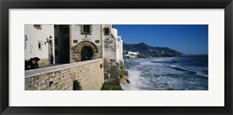 Framed Tourists in a church beside the sea, Sitges, Spain Print