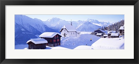 Framed Snow Covered Chapel and Chalets Swiss Alps Switzerland Print