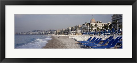 Framed Empty lounge chairs on the beach, Nice, French Riviera, France Print