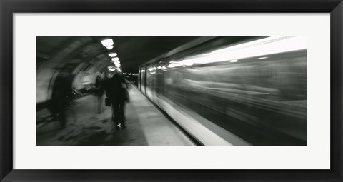 Framed Subway train passing through a subway station, London, England Print