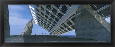 Framed Four people under a structure, Barcelona, Catalonia, Spain Print