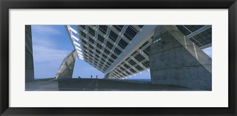 Framed Four people under a structure, Barcelona, Catalonia, Spain Print