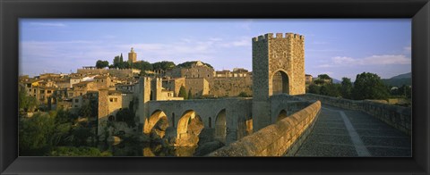 Framed Footbridge across a river in front of a city, Besalu, Catalonia, Spain Print