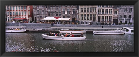 Framed High angle view of tourboats in a river, Leie River, Graslei, Ghent, Belgium Print