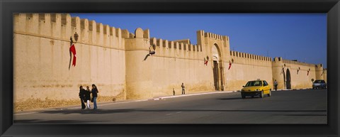 Framed Car on a road in front of a fortified wall, Medina, Kairwan, Tunisia Print