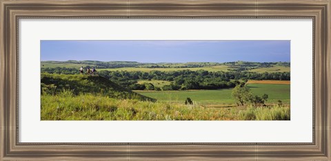 Framed Three mountain bikers on a hill, Kansas, USA Print