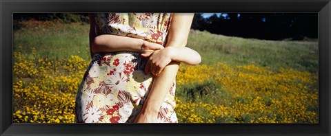 Framed Mid section view of a girl hugging her mother in a field, Marin County, California, USA Print