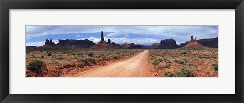 Framed Dirt road through desert landscape with sandstone formations, Utah. Print