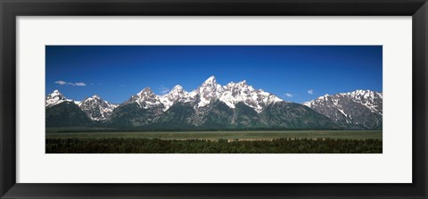 Framed Trees in a forest with mountains in the background, Teton Point Turnout, Teton Range, Grand Teton National Park, Wyoming, USA Print