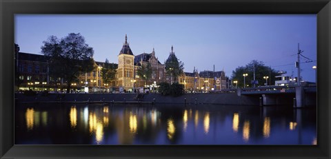 Framed Reflection of a railway station in water, Amsterdam Central Station, Amsterdam, Netherlands Print