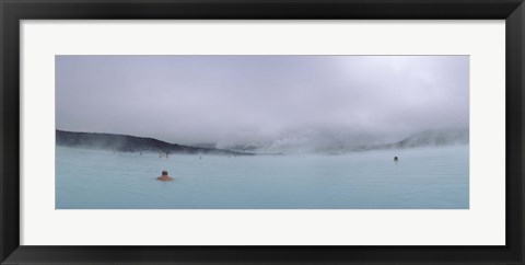 Framed Tourist swimming in a thermal pool, Blue Lagoon, Reykjanes Peninsula, Reykjavik, Iceland Print