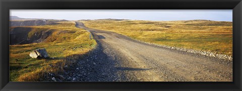 Framed Gravel road passing through a landscape, Cape Bonavista, Newfoundland, Newfoundland and Labrador, Canada Print