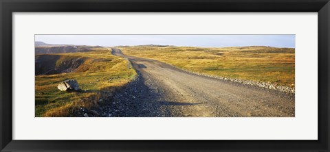 Framed Gravel road passing through a landscape, Cape Bonavista, Newfoundland, Newfoundland and Labrador, Canada Print