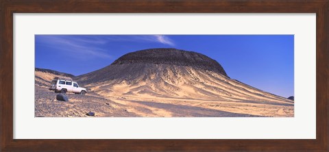 Framed SUV moving in a desert, Black Desert, Bahariya Oasis, Egypt Print